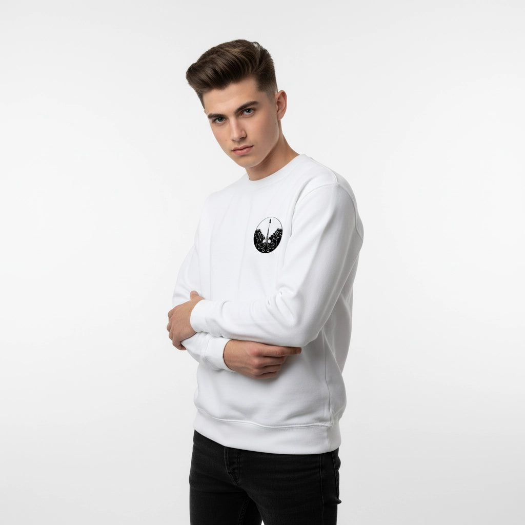 Person wearing a white sweatshirt with a black graphic design on a light gray background