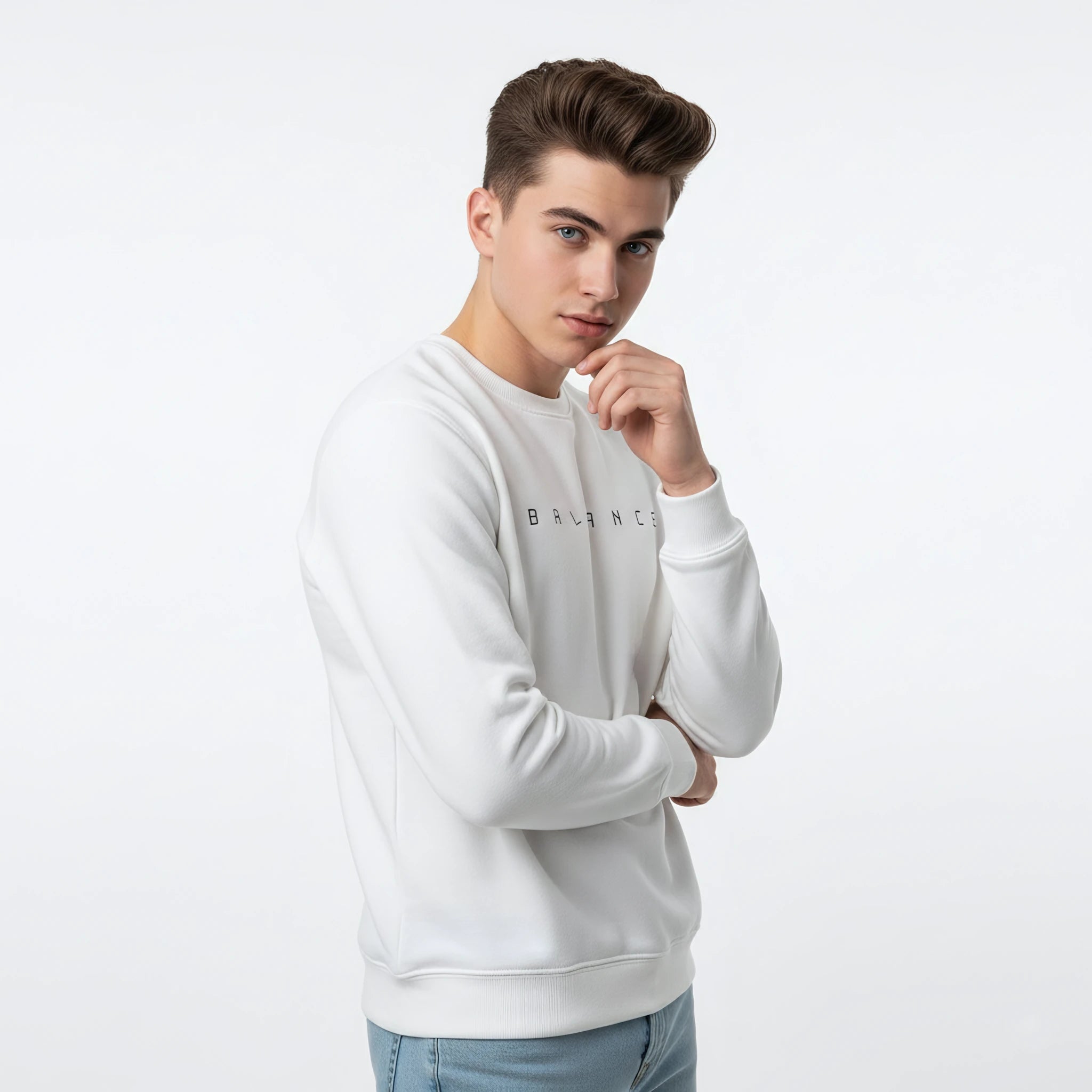 Man wearing a white sweatshirt with a brand logo on a light gray background