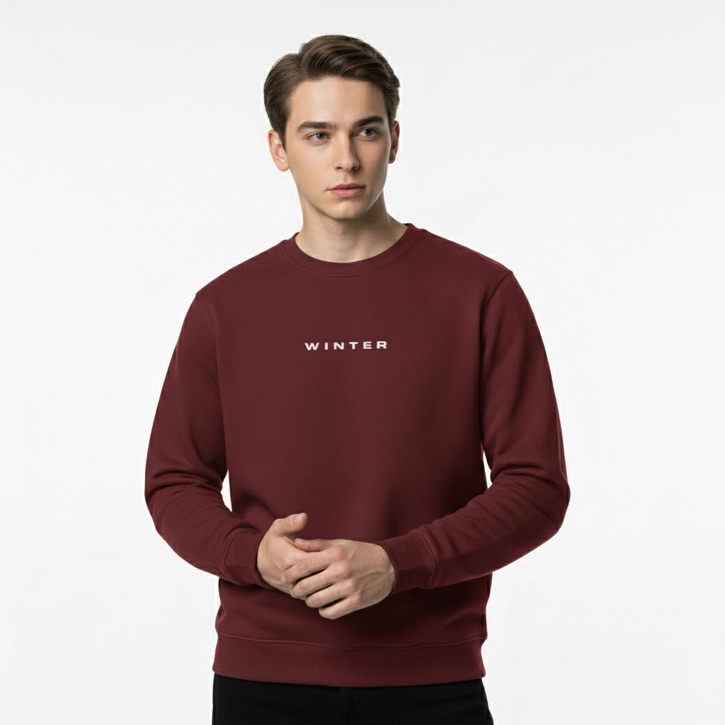 Man wearing a maroon sweatshirt with 'WINTER' text on a white background