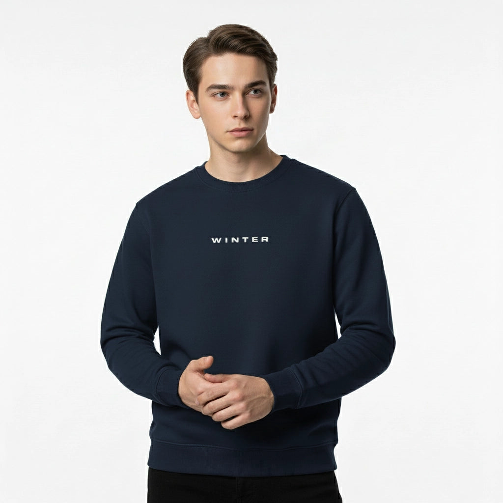 Man wearing a navy blue sweatshirt with 'WINTER' text on a white background