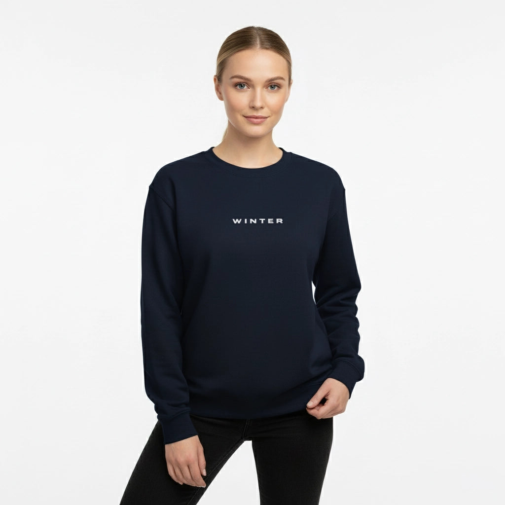 Woman wearing a navy blue sweatshirt with 'WINTER' text on a white background
