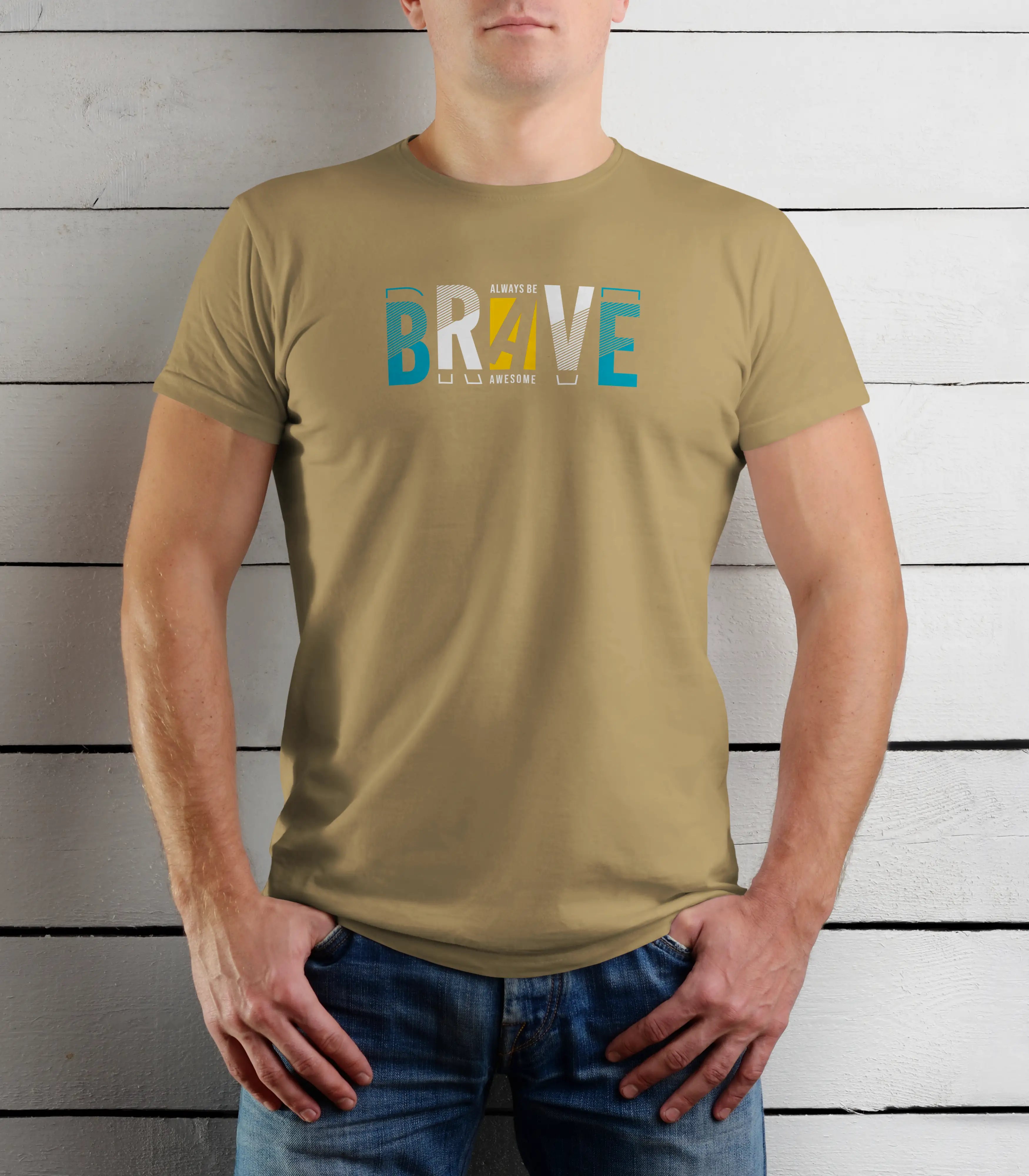 Person wearing a khaki t-shirt with 'BRAVE' printed on it against a wooden background