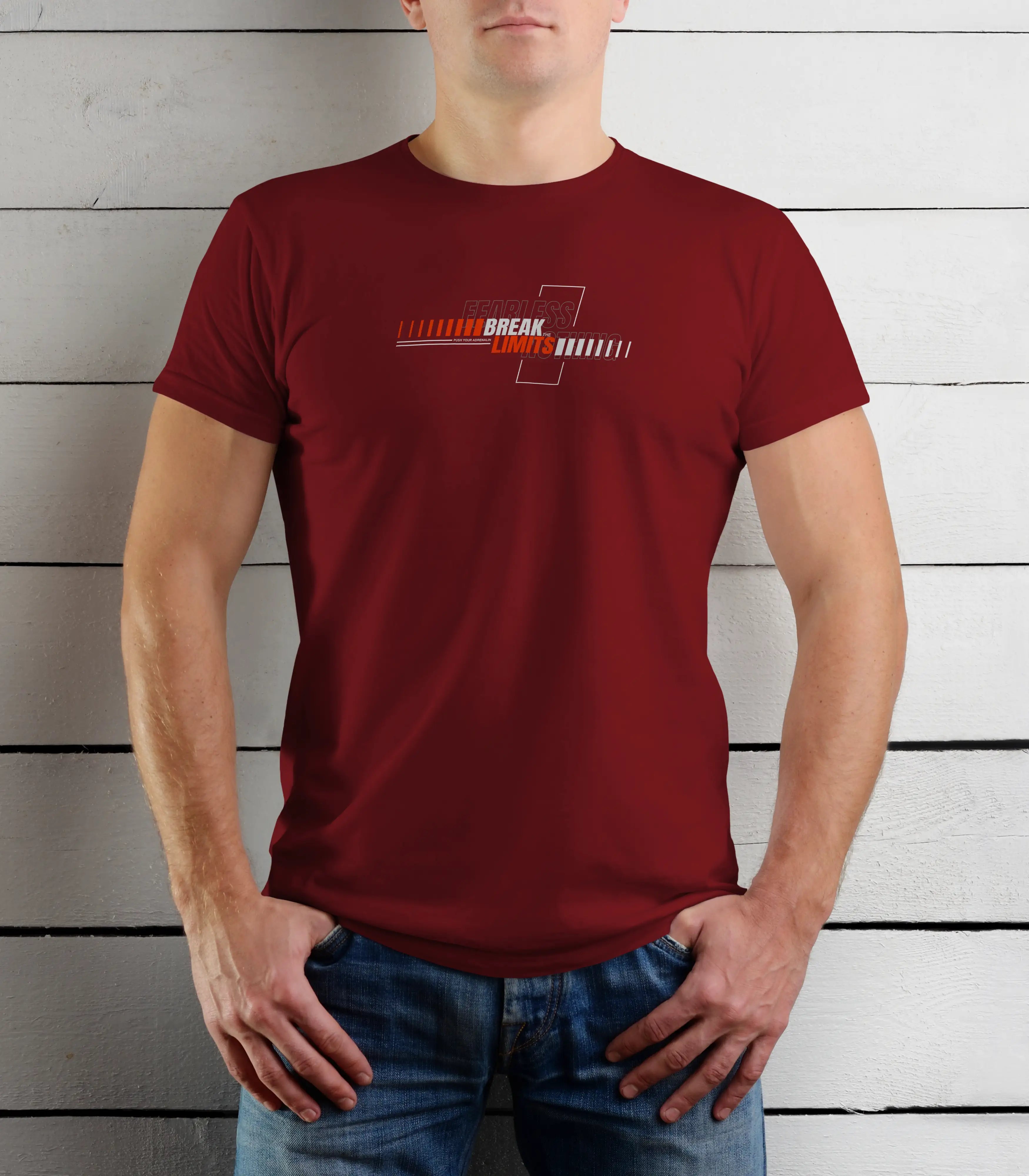 Person wearing a red t-shirt with a logo against a wooden background