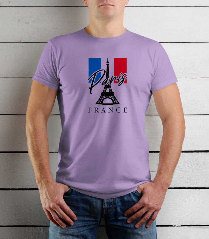 Person wearing a purple t-shirt with Paris and France design against a wooden background