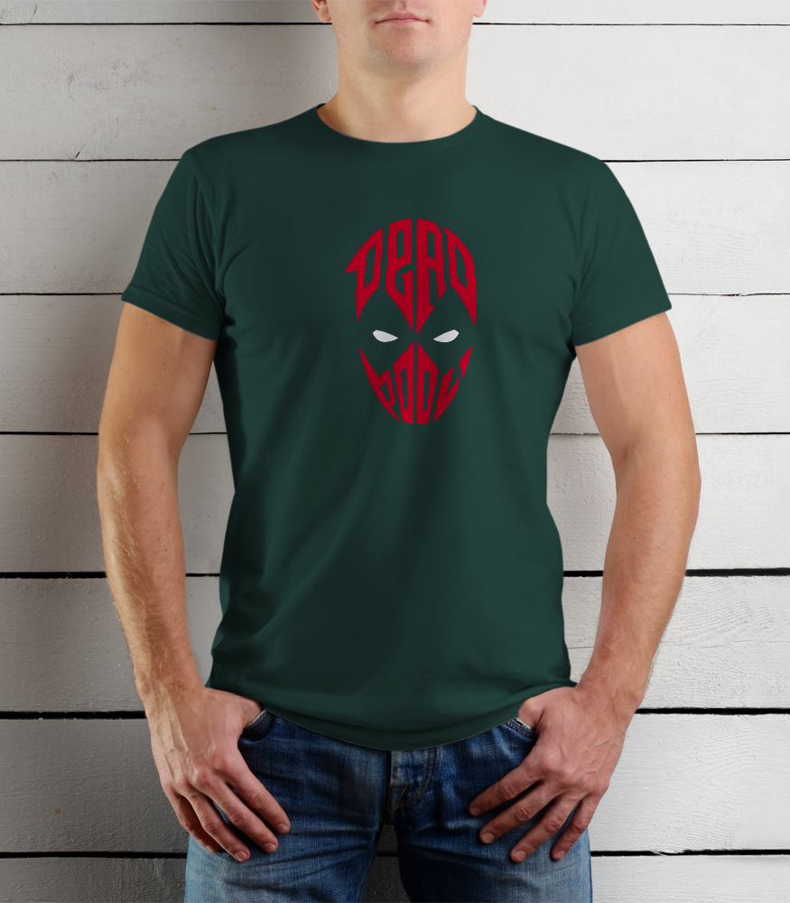 Person wearing a green t-shirt with a red graphic design against a wooden background