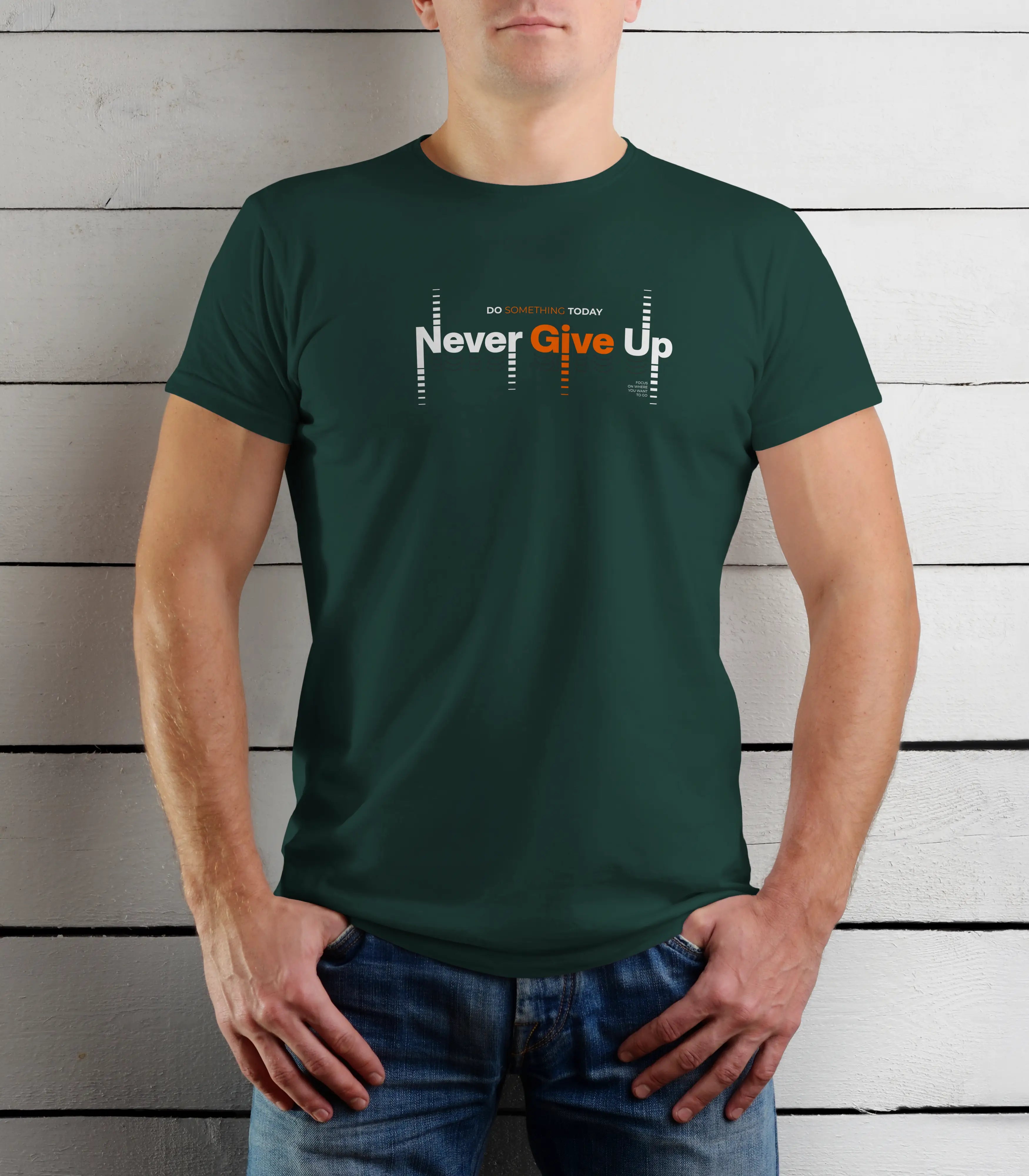 Person wearing a green t-shirt with 'Never Give Up' text against a wooden background