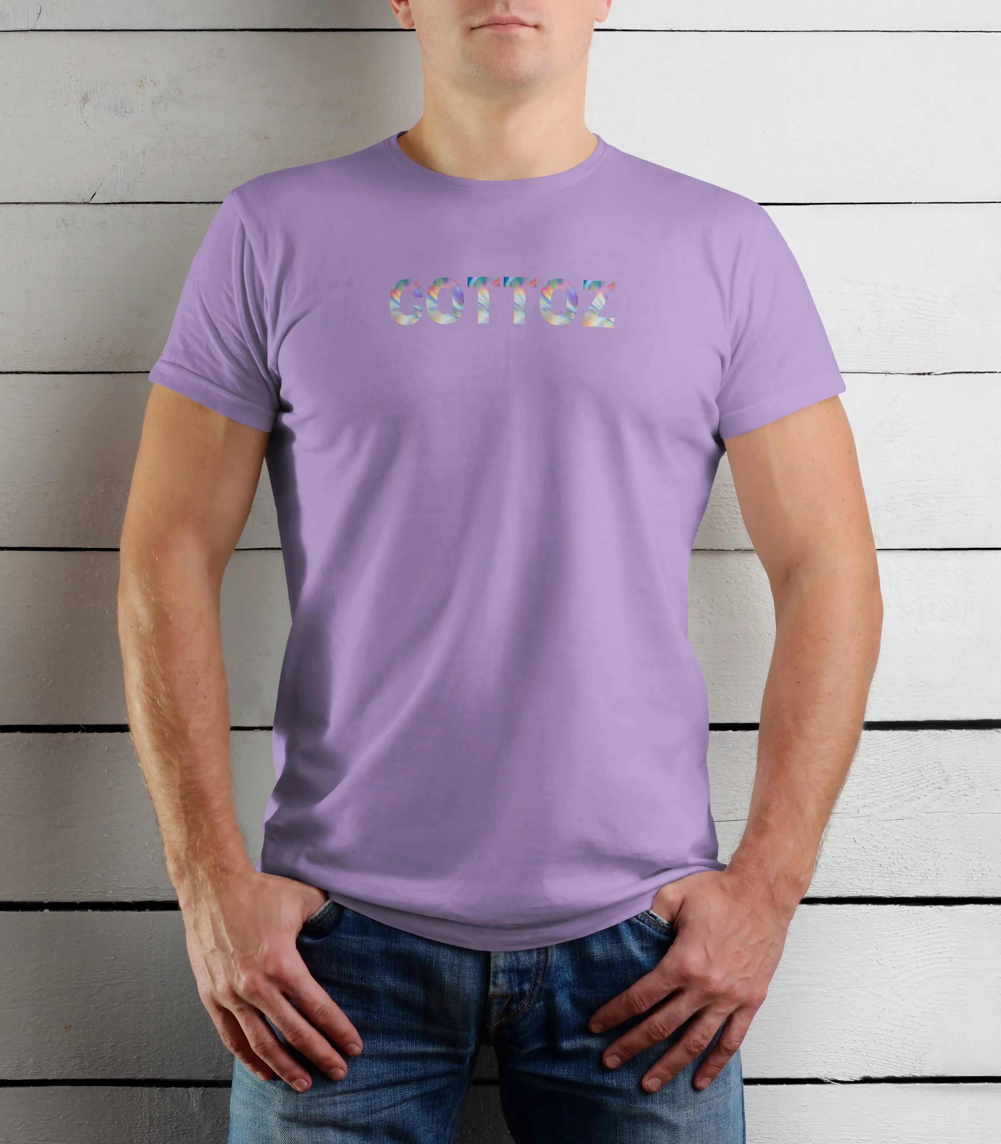 Person wearing a purple t-shirt with colorful text against a wooden background