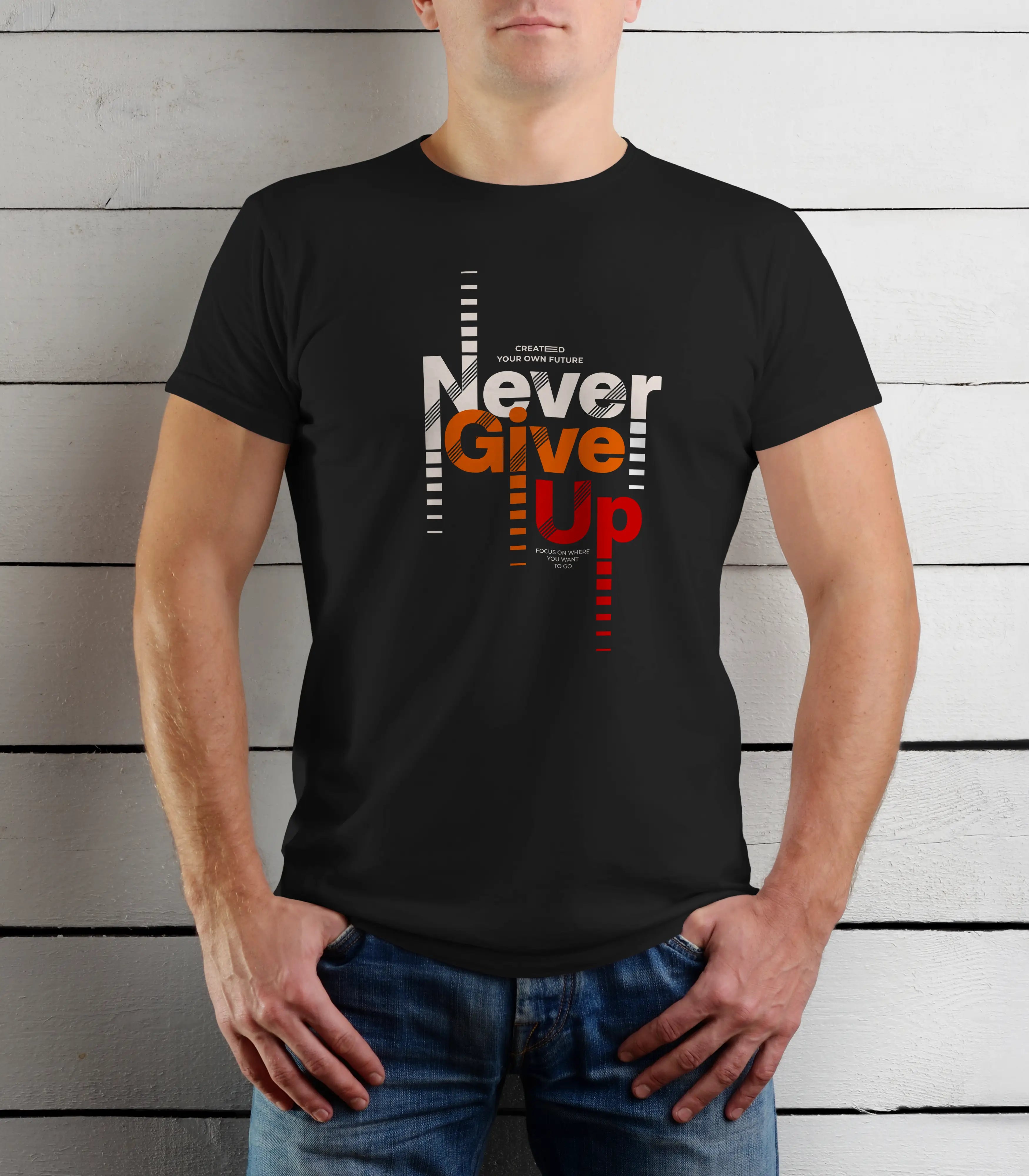 Person wearing a black t-shirt with 'Never Give Up' text design against a wooden background