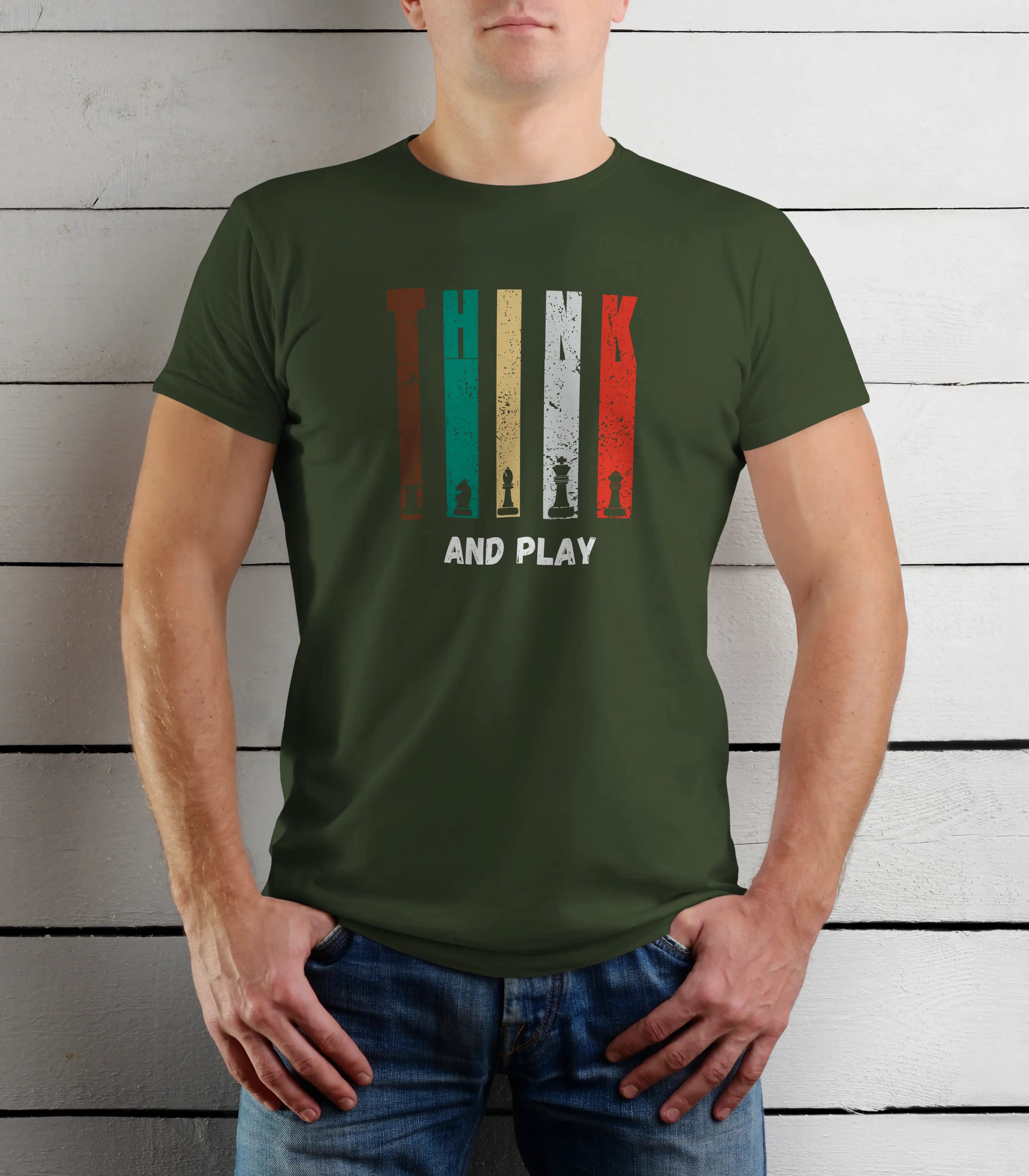 Person wearing a green t-shirt with a graphic design and text against a wooden background