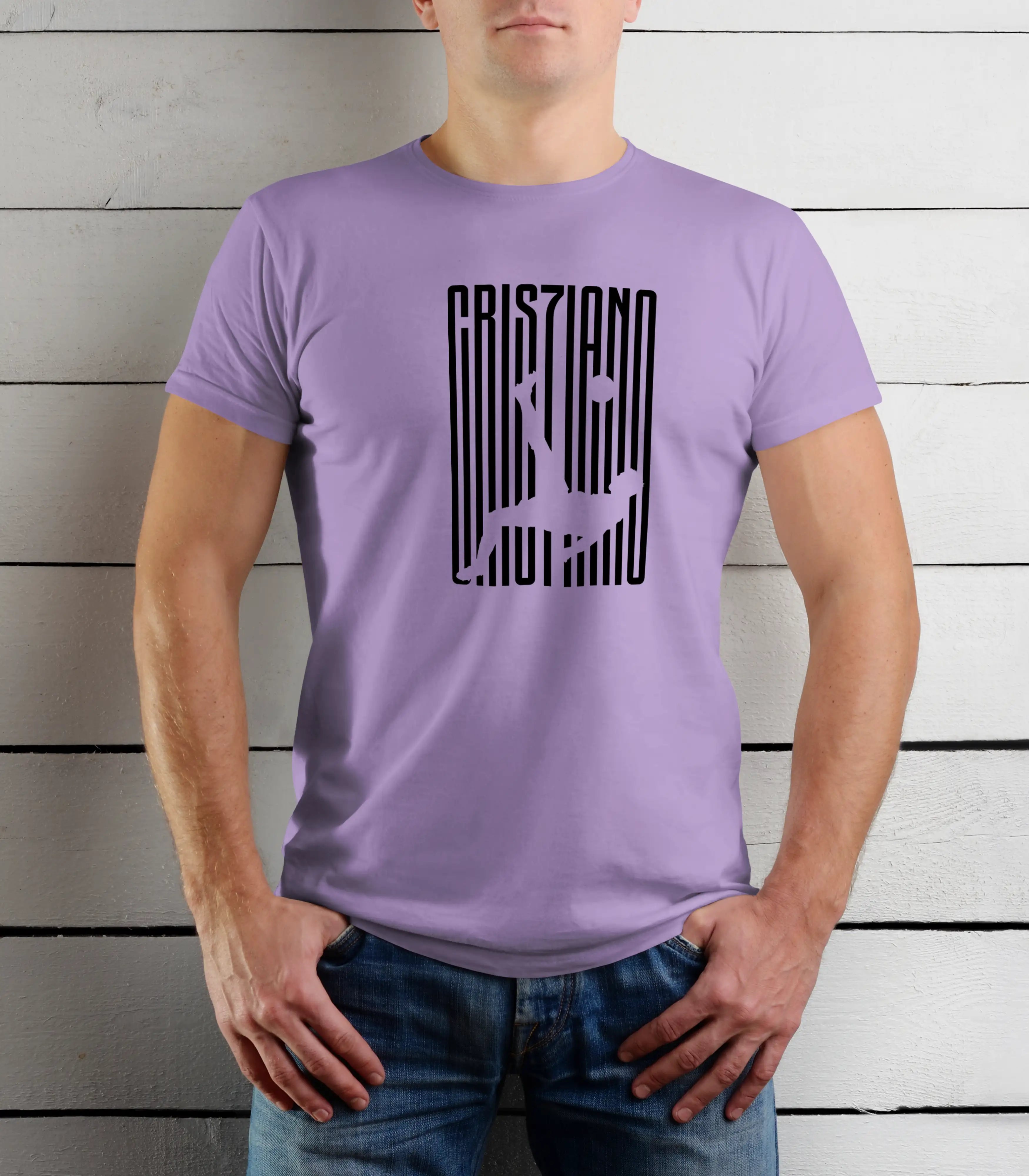 Person wearing a purple t-shirt with black text design against a wooden background