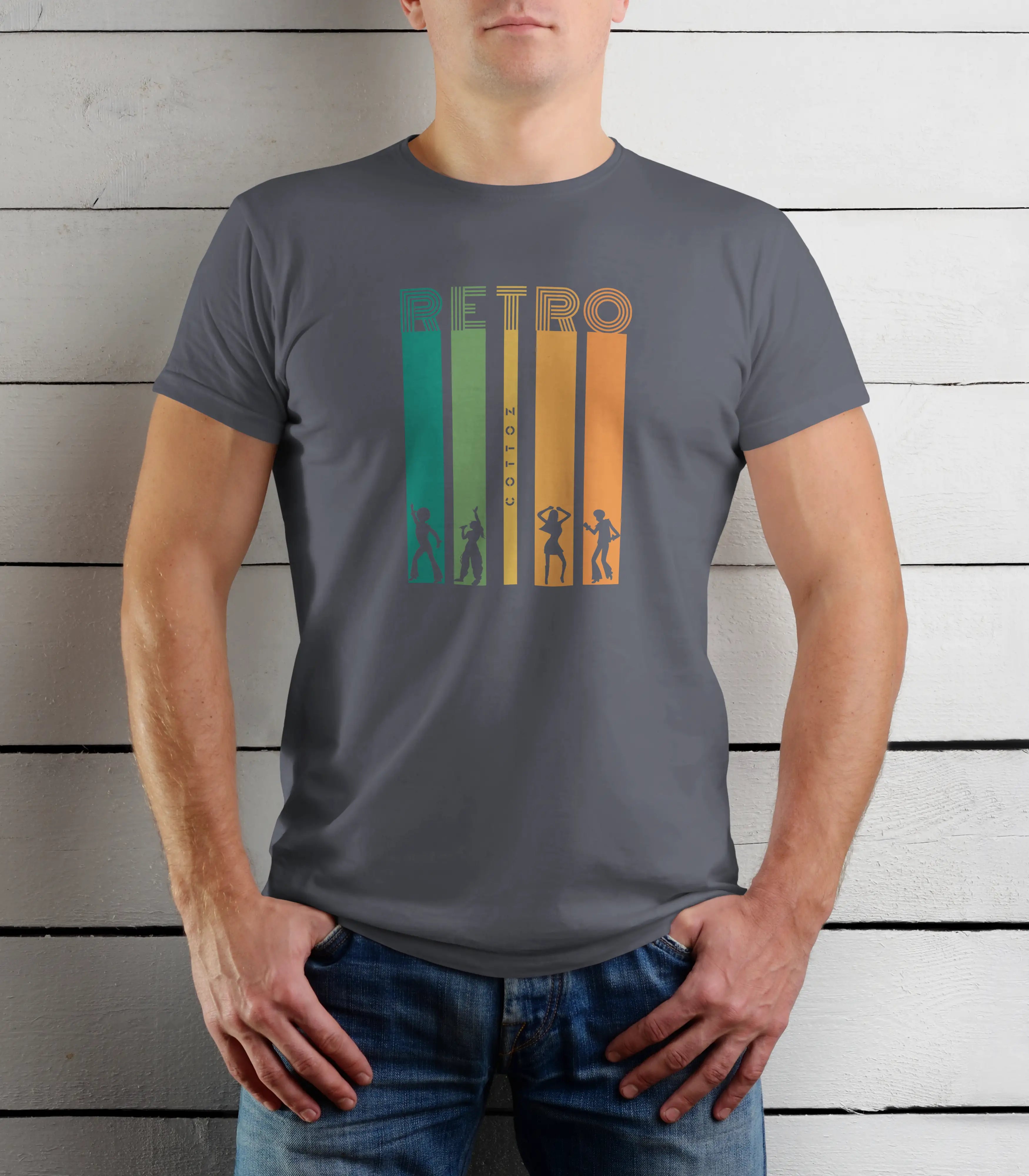 Person wearing a gray t-shirt with a retro design against a wooden background