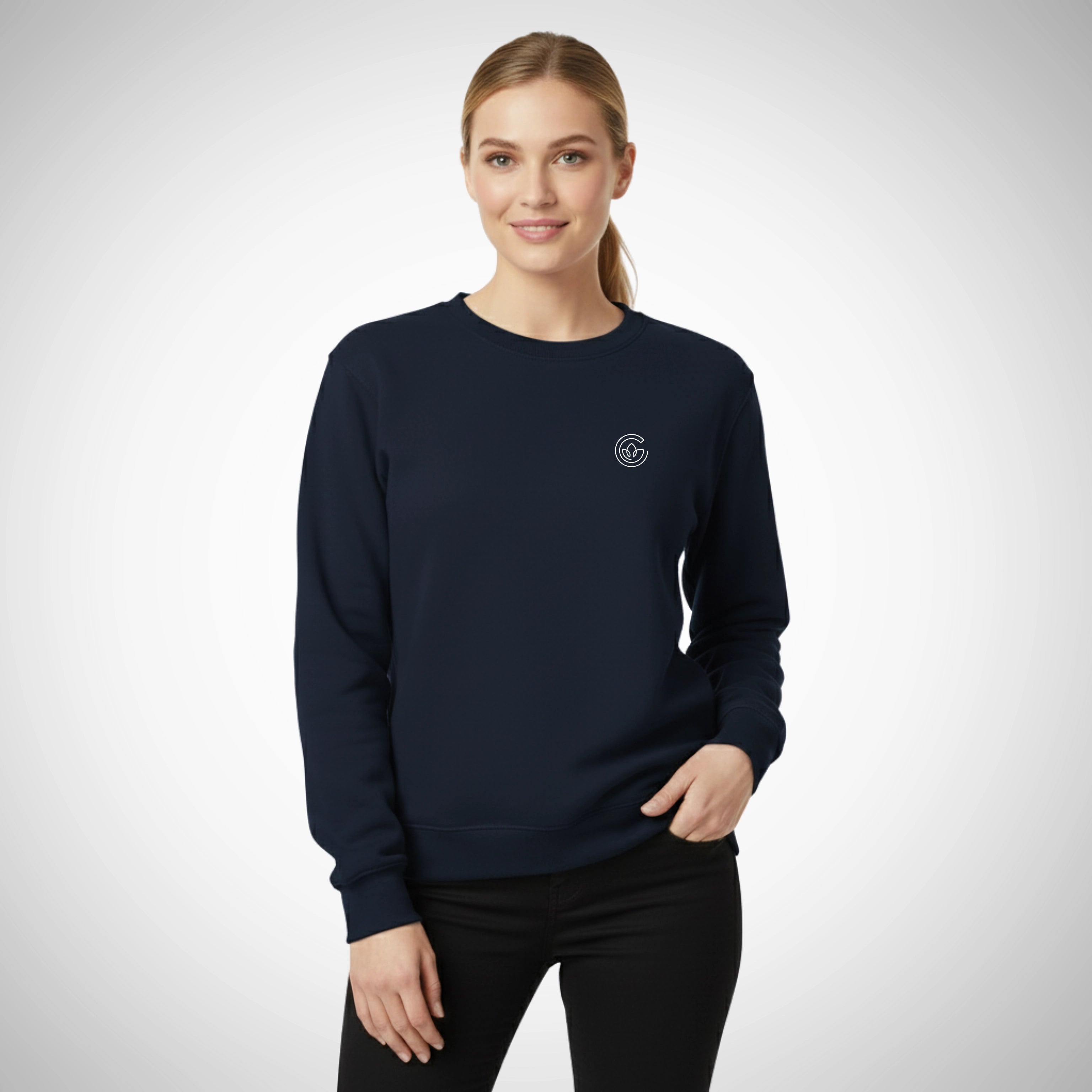 Woman wearing a navy blue sweatshirt with a logo on a white background